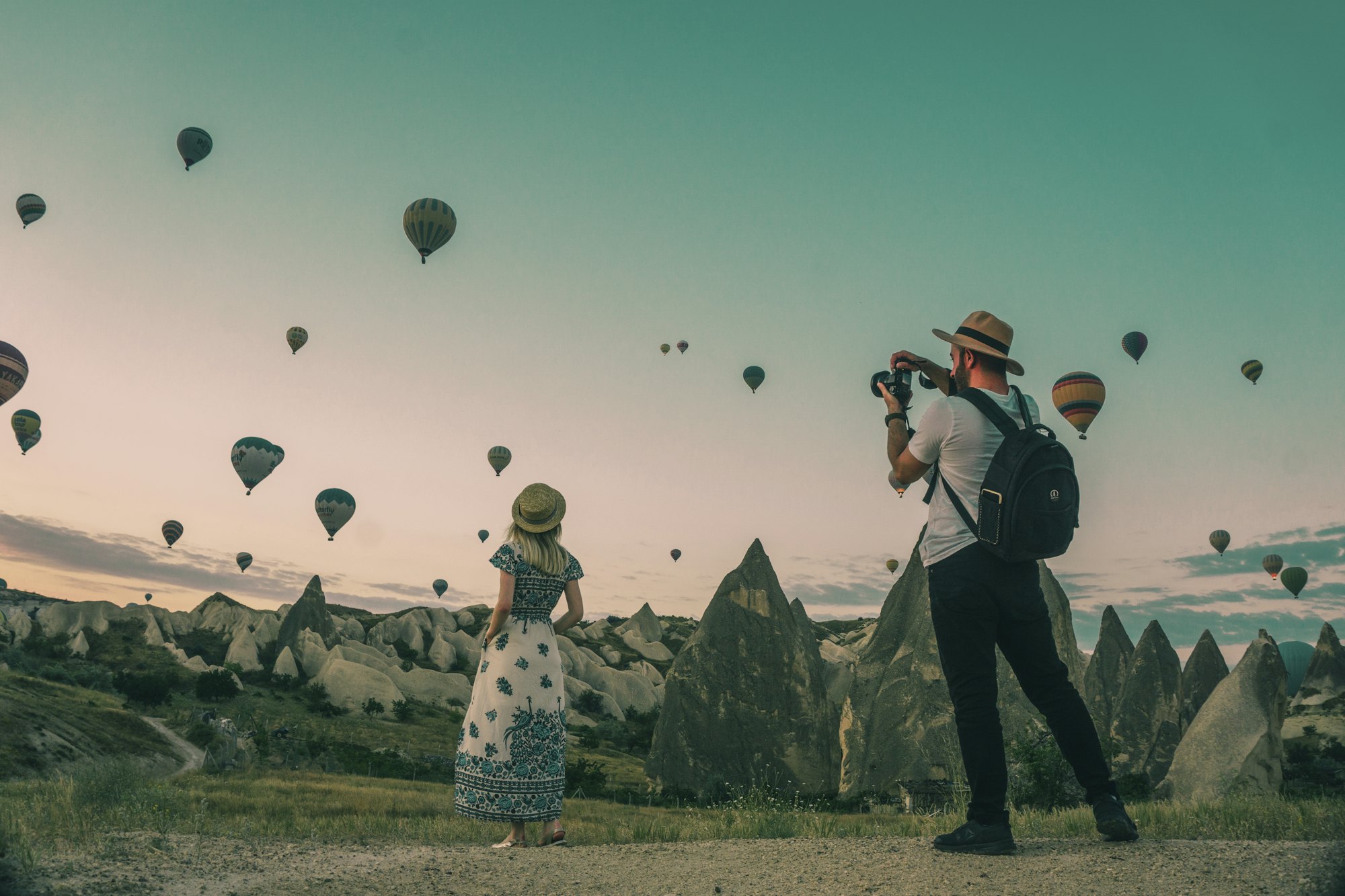 Hot-air balloons drifting over Cappadocia at dawn