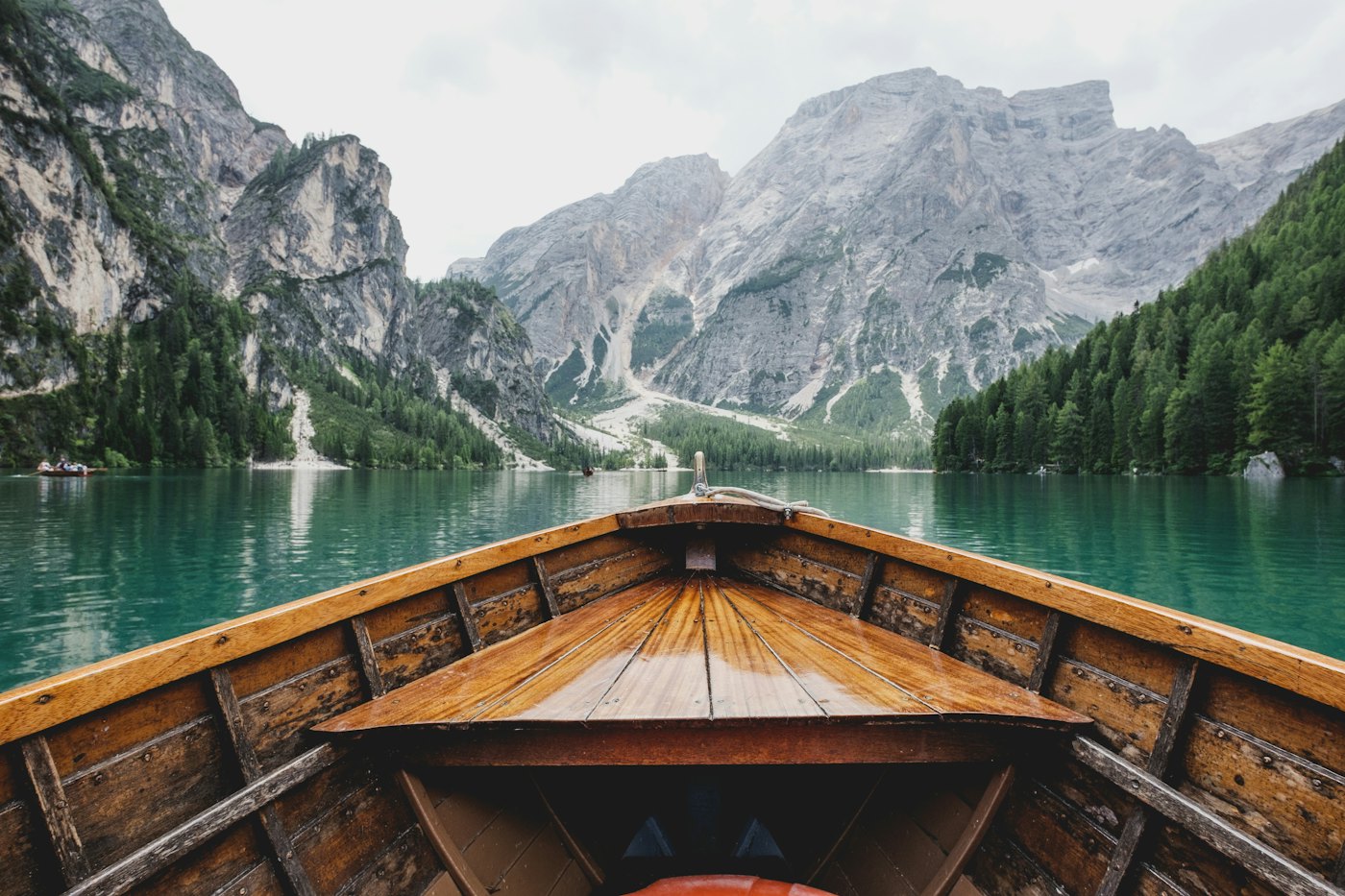 Wooden boat on a turquoise alpine lake